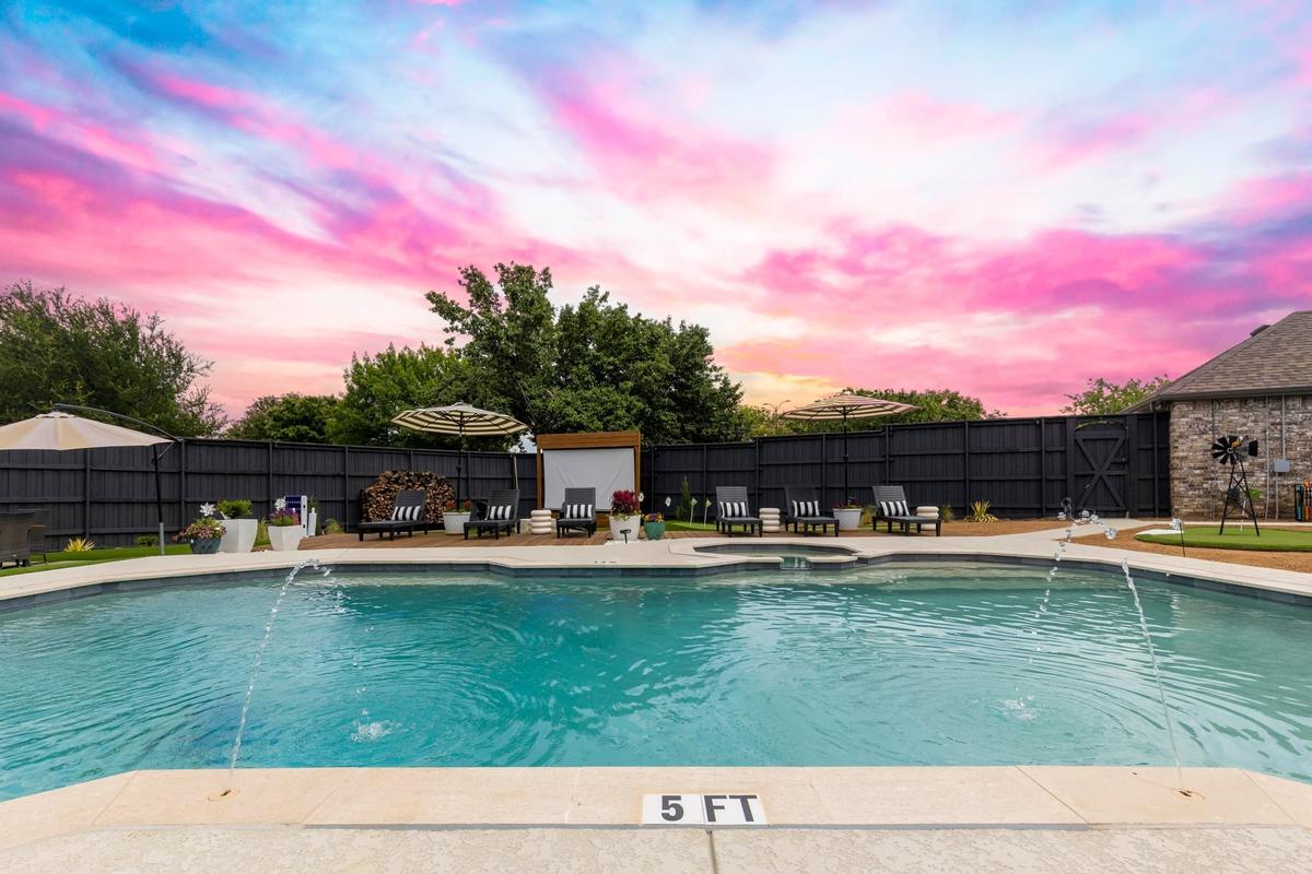 Yard field including pool and hot tub